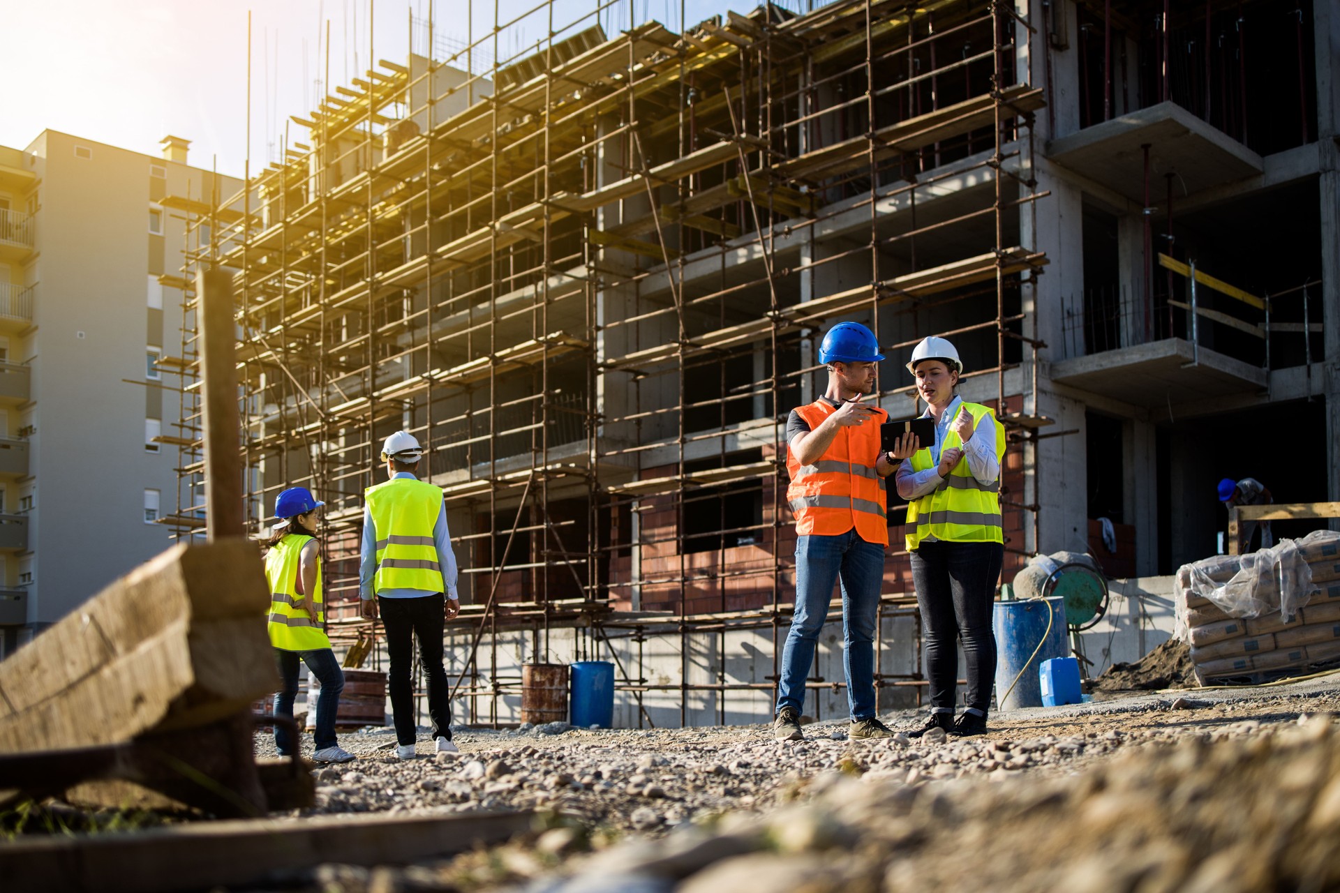 Four construction workers having meeting